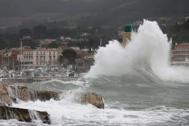 A wave crashes near the lighthouse in the port of Cassis, near Marseille, France as stormy weather with high winds hits part of the French Mediterranean coast January 11, 2016. (Photo by Jean-Paul Pelissier/Reuters)