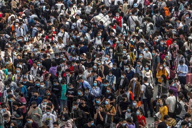 Travellers wait to board the trains on the Railway station in Shanghai, China, 30 April 2021. Labor Day is an annual worldwide celebration of workers and their achievements. May Day holidays in China will have 265 million passenger trips during 2021, said the Ministry of Transport on Thursday. (Photo by Alex Plavevski/EPA/EFE)