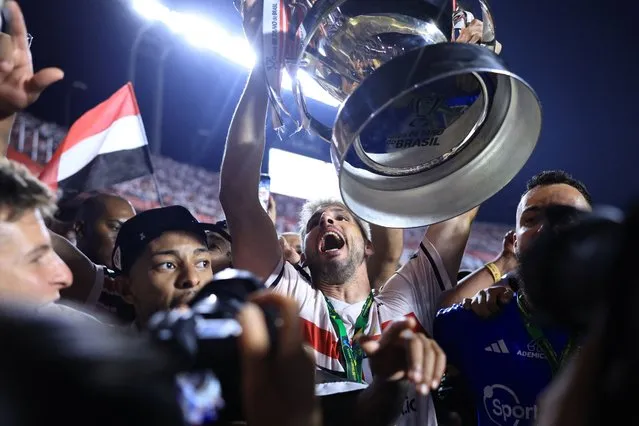 Sao Paulo's forward Jonathan Calleri holds the trophy at the end of the Copa do Brasil final second leg football match between Flamengo and Sao Paulo at the Morumbi stadium in Sao Paulo, Brazil, on September 24, 2023. (Photo by Marcello Zambrana/AFP Photo)