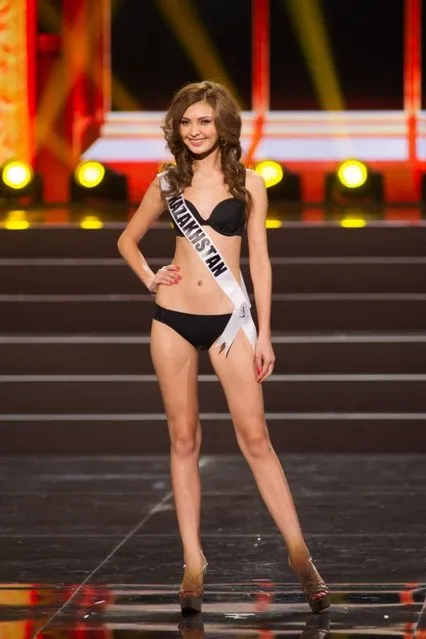 This photo provided by the Miss Universe Organization shows Aigerim Kozhakhanova, Miss Kazakhstan 2013, competes in the swimsuit competition during the Preliminary Competition at Crocus City Hall, Moscow, on November 5, 2013. (Photo by Darren Decker/AFP Photo)