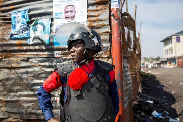 Police officers patrol Majengo neighborhood in Goma, on December 27, 2018, following a demonstration against the postponement, announced the day before by the Congolese national committee, of the general elections in this area because of the Ebola outbreak and the mass killings of civilians in this trouble part of DRC. Already postponed three times, the elections are due to bring the curtain down on the era of President Joseph Kabila, in charge of the vast mineral-rich country for nearly 18 turbulent years. (Photo by Patrick Meinhardt/AFP Photo)