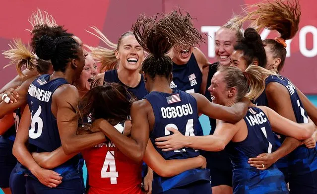 Players of the United States celebrate after defeating Serbia in the women's volleyball semifinals at the Tokyo Olympics on August 6, 2021, at Ariake Arena. (Photo by Valentyn Ogirenko/Reuters)