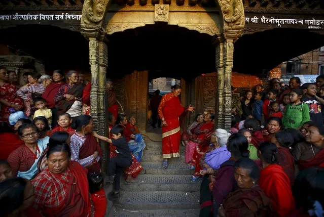 Nepalese people gather to observe the Bisket festival at Bhaktapur April 10, 2015. (Photo by Navesh Chitrakar/Reuters)