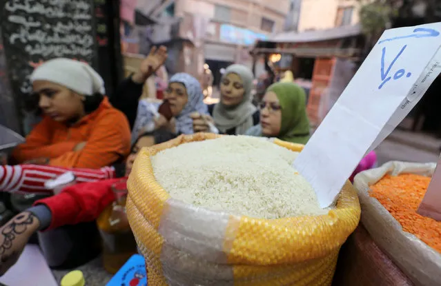 Egyptian women buy food at a vegetable market in Cairo, Egypt January 10, 2017. (Photo by Mohamed Abd El Ghany/Reuters)