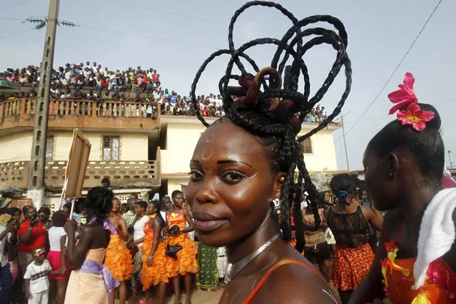 People take part in a parade during the Popo (Mask) Carnival of Bonoua, in the east of Abidjan, April 18, 2015. (Photo by Luc Gnago/Reuters)