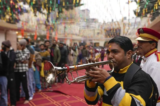 Member of a traditional brass band performs at Raghutnath temple in Jammu, India, during the opening of a temple dedicated to Hindu deity Lord Ram, in Ayodhya, Monday, January 22, 2024. Indian Prime Minister Narendra Modi on Monday opened a controversial Hindu temple built on the ruins of a historic mosque in the holy city of Ayodhya in a grand event that is expected to galvanize Hindu voters in upcoming elections. (Photo by Channi Anand/AP Photo)