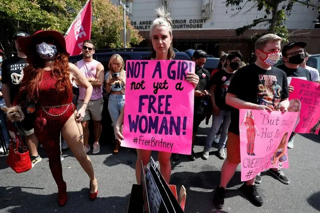 Supporters of pop star Britney Spears hold signs as they gather on the day of a conservatorship case hearing at Stanley Mosk Courthouse in Los Angeles, California, U.S., September 29, 2021. (Photo by Mario Anzuoni/Reuters)