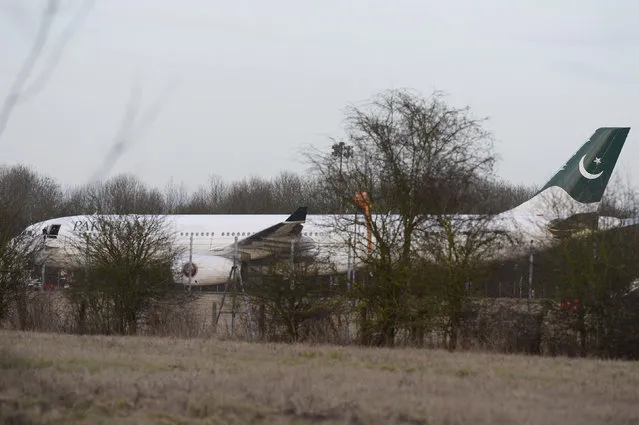 An Airbus A330 of Pakistan International Airlines on the tarmac at Stansted Airport, Tuesday February 7, 2017, which was intercepted by RAF Typhoon jets after reports of a disruptive passenger onboard. The flight, PK757, was scheduled to land at London's Heathrow Airport on it's flight from Lahore, Pakistan. (Photo by John Stillwell/PA Wire via AP Photo)