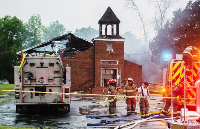 Firefighters and fire investigators respond to a fire at Mt. Pleasant Baptist Church Thursday, April 4, 2019, in Opelousas, La. Authorities in southern Louisiana are investigating a string of “suspicious” fires at three African American churches in recent days. Fire Marshal H. “Butch” Browning said it wasn't clear whether the fires in St. Landry Parish are connected and he declined to get into specifics of what the investigation had yielded so far but described the blazes as “suspicious”. (Photo by Leslie Westbrook/The Advocate via AP Photo)