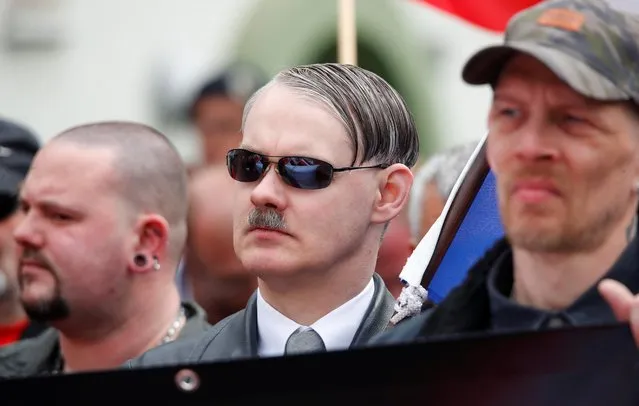 A look-alike of Adolf Hitler from the Netherlands attends a march of far-right supporters of the party 'Die Rechte (The Rights)' during a May Day rally through the streets of Duisburg, Germany on May 1, 2019. (Photo by Wolfgang Rattay/Reuters)