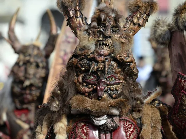 Masks are very often hand crafted especially for the themed parade. (Photo by Urs Flueeler/EPA)