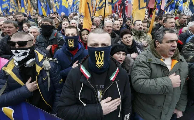 Activists of nationalist groups and their supporters take part in the so-called March of Dignity, marking the third anniversary of the 2014 Ukrainian pro-European Union (EU) mass protests, in Kiev, Ukraine, February 22, 2017. (Photo by Valentyn Ogirenko/Reuters)