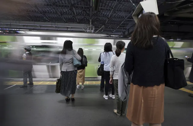 Commuters wait to get on a train at a station Wednesday, May 22, 2019, in Tokyo. A police-developed smartphone app with anti-s*x crime alarms has won massive subscriptions as Japanese women try to arm themselves against gropers on packed rush-hour trains. (Photo by Eugene Hoshiko/AP Photo)