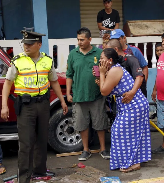 People react after an earthquake struck off Ecuador's Pacific coast, at Tarqui neighborhood in Manta April 17, 2016. (Photo by Guillermo Granja/Reuters)