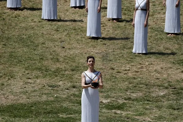 Greek actress Katerina Lehou, playing the role of High Priestess, carries the Olympic flame during the dress rehearsal for the Olympic flame lighting ceremony for the Rio 2016 Olympic Games at the site of ancient Olympia in Greece, April 20, 2016. (Photo by Alkis Konstantinidis/Reuters)
