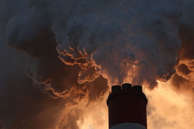 Smoke and steam billow from Belchatow Power Station, Europe's largest coal-fired power plant powered by lignite, operated by Polish utility PGE, in Rogowiec, Poland on November 22, 2023. (Photo by Kacper Pempel/Reuters)