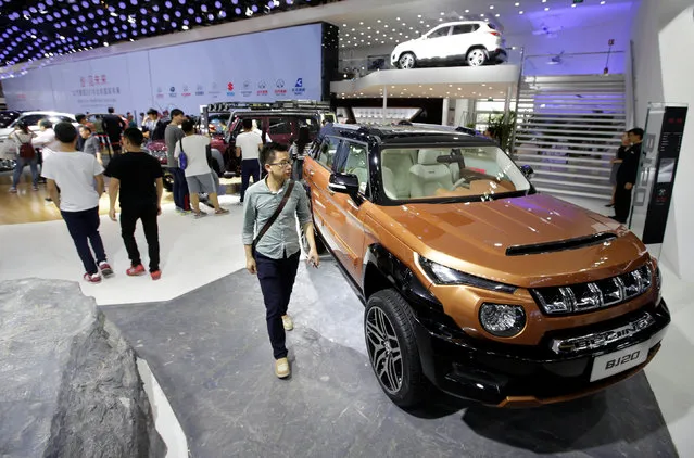 A visitor walks past a BJ 20 from BAIC Group presented during the Auto China 2016 auto show in Beijing, China May 4, 2016. (Photo by Jason Lee/Reuters)
