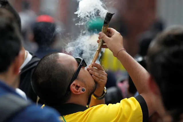 A man smokes marijuana during a global March for marijuana in Bogota, Colombia, May 7, 2016. (Photo by John Vizcaino/Reuters)