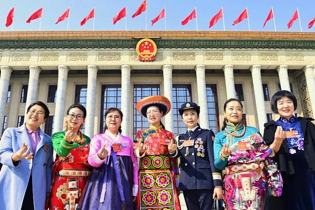 Women deputies pose for a group photo in front of the Great Hall of the People to celebrate the International Women's Day after the second plenary meeting of the fifth session of the 13th National People's Congress (NPC) on March 8, 2022 in Beijing, China. (Photo by VCG/VCG via Getty Images)