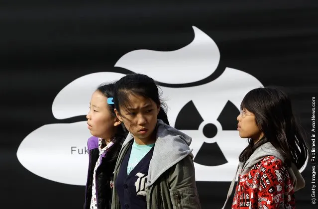 South Korean girls participate in a rally held to commemorate the Fukushima nuclear disaster on the eve of the one year anniversary of Japan's earthquake and tsunami