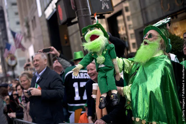 Revelers watch the 251st annual St. Patrick's Day Parade March 17, 2012 in New York City