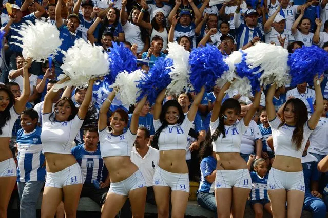 Cherrleaders perform during a program in support of the Honduran national football team in Tegucigalpa, on June 5, 2014. (Photo by Orlando Sierra/AFP Photo)