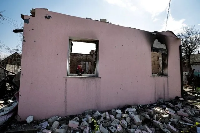 Svitlana Karpenko, 53, shows her house, that according to her was destroyed by shelling, amid Russian invasion of Ukraine in Sloboda, Chernihiv region, Ukraine on May 3, 2022. (Photo by Zohra Bensemra/Reuters)