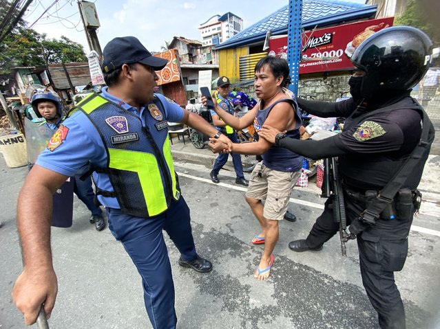 Anti-riot police detain a Filipino informal settler during a demolition raid at a shanty town in Pasay City, Metro Manila, Philippines, 01 August 2024. (Photo by Francis R. Malasig/EPA)