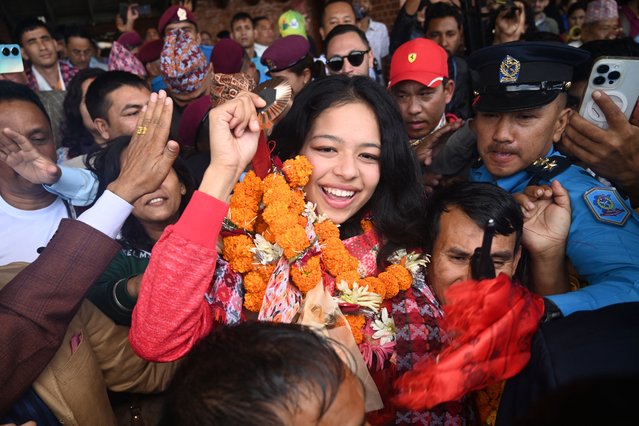 Paris 2024 Paralympic Games taekwondo bronze medallist Palesha Goverdhan greets the crowd upon her arrival at the Tribhuvan International Airport in Kathmandu on September 4, 2024. Nepal celebrated on September 4 winning its first-ever Olympic medal, with cheering crowds giving Paralympic taekwondo star Palesha Goverdhan a hero's welcome as she returned home. (Photo by  Prakash Mathema/AFP Photo)