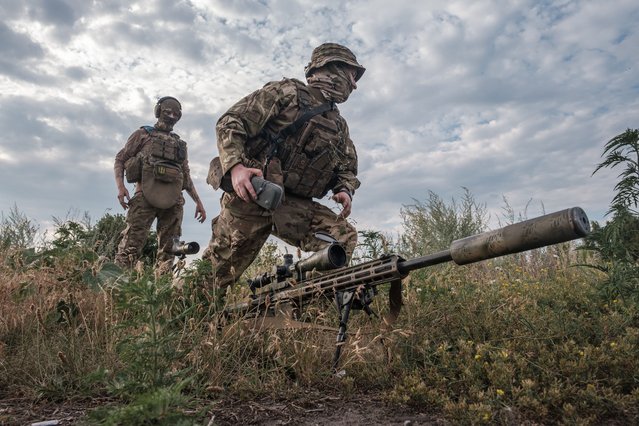 Sniper of the 1st brigade of National Guard "Bureviy' takes part in a military training in Donetsk Oblast, Ukraine on July 9, 2024. Ukrainian snipers are highly trained and capable of causing damage, and are therefore a priority target for Russian troops. Their frontline tasks include shooting down soldiers at Russian observation posts, providing observation to assist artillery fire, and stopping Russian waves when they attack. (Photo by Pablo Miranzo/Anadolu via Getty Images)