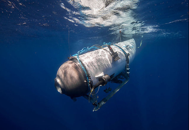 This undated image courtesy of OceanGate Expeditions, shows their Titan submersible beginning a descent. Rescue teams expanded their search underwater on June 20, 2023, as they raced against time to find a Titan deep-diving tourist submersible that went missing near the wreck of the Titanic with five people on board and limited oxygen. All communication was lost with the 21-foot (6.5-meter) Titan craft during a descent June 18 to the Titanic, which sits at a depth of crushing pressure more than two miles (nearly four kilometers) below the surface of the North Atlantic. (Photo by Handout/OceanGate Expeditions via AFP Photo)