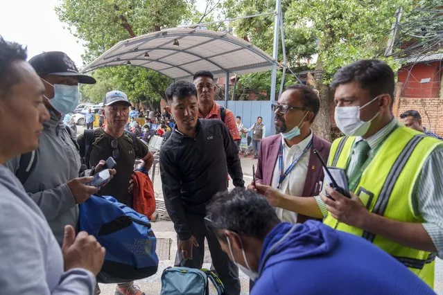 A team of climbers prepare to leave for rescue operations from the Tribhuvan International Airport in Kathmandu, Nepal, Sunday, May 29, 2022. A small airplane with 22 people on board flying on a popular tourist route was missing in Nepal’s mountains on Sunday, an official said. The Tara Airlines plane, which was on a 15-minute scheduled flight to the mountain town of Jomsom, took off from the resort town of Pokhara, 200 kilometers (125 miles) east of Kathmandu. It lost contact with the airport tower shortly after takeoff. (Photo by Niranjan Shreshta/AP Photo)