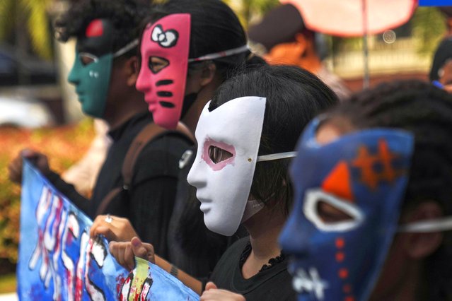 Masked activists take part in a Global Climate Strike rally in Jakarta, Indonesia, Friday, September 27, 2024. (Photo by Dita Alangkara/AP Photo)