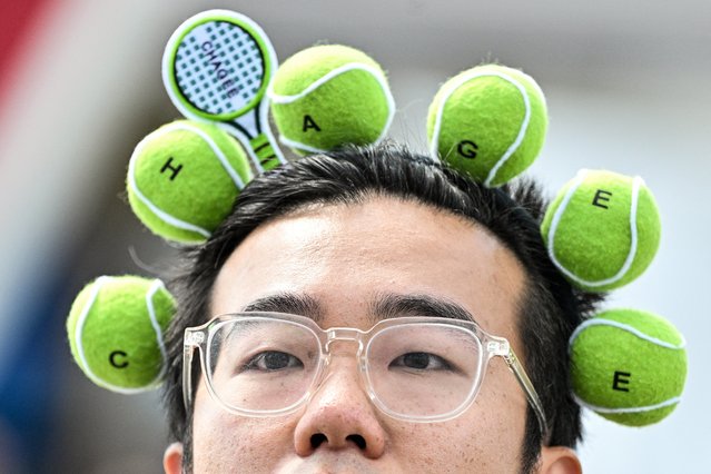 A fan attends the Shanghai Masters tennis tournament in Shanghai on October 2, 2024. (Photo by Hector Retamal/AFP Photo)