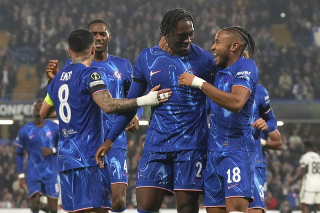 Chelsea's Axel Disasi, second right, celebrates with Chelsea's Christopher Nkunku after scoring his side's third goal during the Europa Conference League opening phase soccer match between Chelsea and FC Noah at Stamford Bridge stadium in London Thursday, November 7, 2024. (Photo by Frank Augstein/AP Photo)