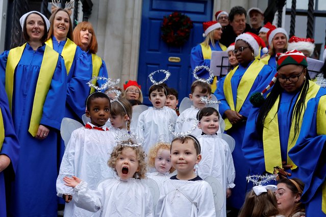 Children from St. Joseph's nursery sing alongside Lucan Gospel Choir at a live animal Christmas nativity crib, in Dublin, Ireland, on December 11, 2024. (Photo by Clodagh Kilcoyne/Reuters)
