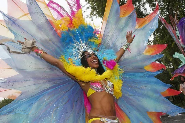 A performer poses for a photograph at the Notting Hill Carnival in west London, August 31, 2015. (Photo by Eddie Keogh/Reuters)