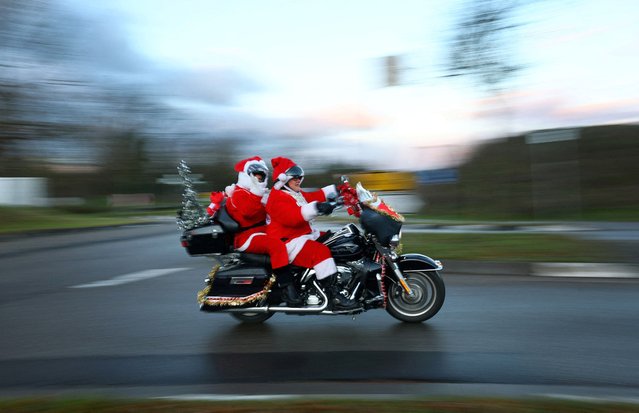 Members of the "Riding Santas" Harley Davidson club take part in their 10th ride to distribute sweets to children and collect money for a children's hospice in Jockgrim, near Neustadt an der Weinstrasse, Germany on December 6, 2024. (Photo by Kai Pfaffenbach/Reuters)