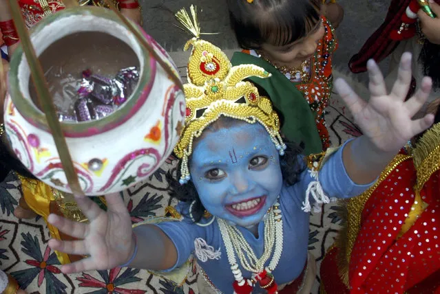 A child dressed as Lord Krishna participates in a fancy dress competition ahead of “Janamashtmi” celebrations in Shimla, capital of Himachal Pradesh August 22, 2008. (Photo by Anil Dayal/Reuters)
