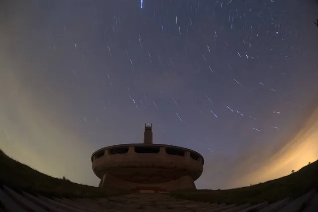 Star trails form over the Memorial House of the Bulgarian Communist Party on mount Buzludzha in this long exposure picture taken on September 12, 2014. The monument was officially opened in 1981 by the Bulgarian Communist regime to mark 100 years of the set up of an organised Socialist movement, a predecessor of the Bulgarian Communist Party. (Photo by Stoyan Nenov/Reuters)