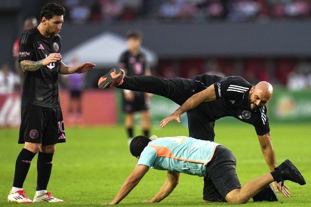 Lionel Messi's personal bodyguard tries to catch a fan who ran onto the field during a friendly soccer match between the United States' Inter Miami and Panama's Sporting San Miguelito, in Panama City, February 2, 2025. (Photo by Matias Delacroix/AP Photo)