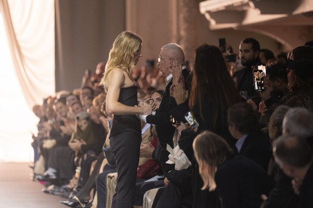 Designer Ludovic de Saint Sernin greets Jean Paul Gaultier at the end of the Jean Paul Gaultier Haute Couture Spring Summer 2025 collection, in Paris, Wednesday, January 29, 2025. (Photo by Lewis Joly/AP Photo)