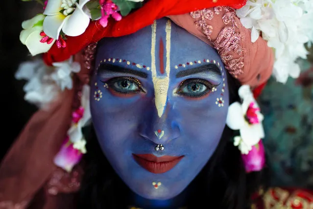 On the festival of Krishna Janmashtami, a girl costumed as Lord Krishna poses for a photo in Dhaka, Bangladesh on August 19, 2022. (Photo by Nayem Shaan/ZUMA Press Wire/Rex Features/Shutterstock)