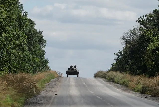 Ukrainian servicemen drive out of Bakhmut, as Russia's attack on Ukraine continues, in Donetsk region, eastern Ukraine on September 7, 2022. (Photo by Ammar Awad/Reuters)