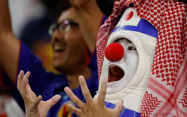 Fans of Japan cheer during the FIFA World Cup Qatar 2022 Round of 16 match between Japan and Croatia at Al Janoub Stadium on December 5, 2022 in Al Wakrah, Qatar. (Photo by John Sibley/Reuters)