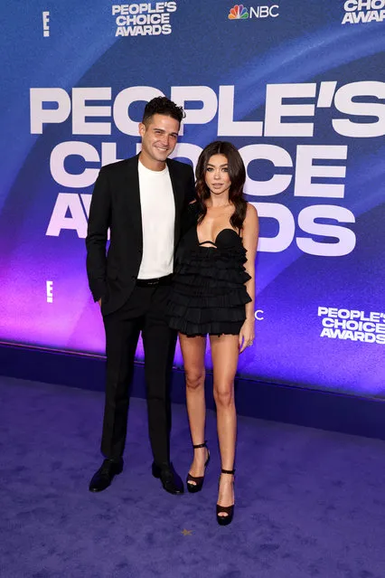 Wells Adams and American actress and singer Sarah Hyland arrive to the 2022 People's Choice Awards held at the Barker Hangar on December 6, 2022 in Santa Monica, California. (Photo by Todd Williamson/E! Entertainment/NBC via Getty Images)