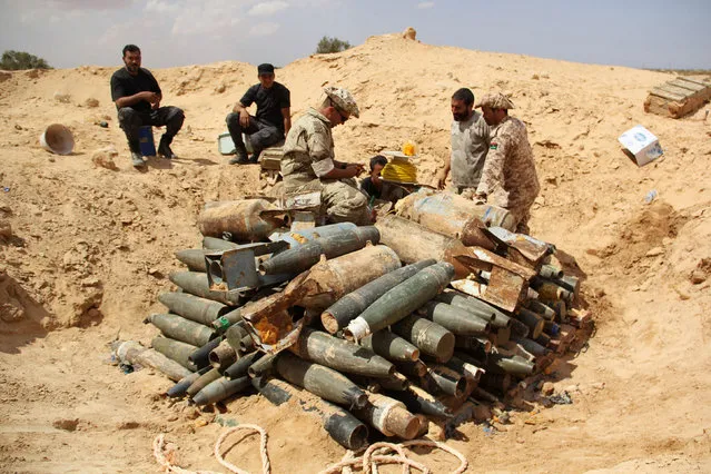 Libyan forces prepare to detonate and dispose of explosives and shells left behind by Islamic State militants in Sirte following a battle, in Misrata Libya, September 9, 2016. (Photo by Reuters/Stringer)