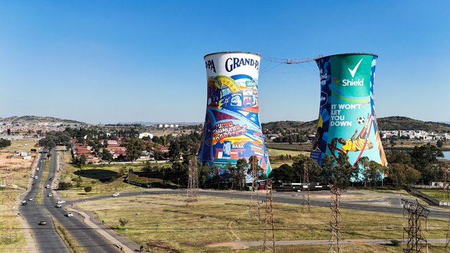 A drone view shows the cooling towers of the defunct Orlando Power Station, a distinctive landmark now used as an advertising display and a bungee jump set up between them, in Soweto, South Africa, on May 12, 2025. (Photo by Siphiwe Sibeko/Reuters)