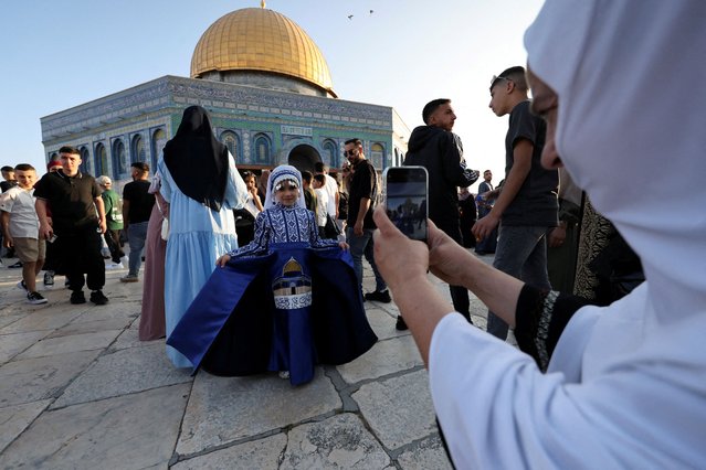 A Palestinian girl in traditional attire poses for a picture, on the first day of the Muslim holiday of Eid al-Adha on the Al-Aqsa compound, also known to Jews as the Temple Mount, in Jerusalem's Old City on June 6, 2025. (Photo by Ammar Awad/Reuters)