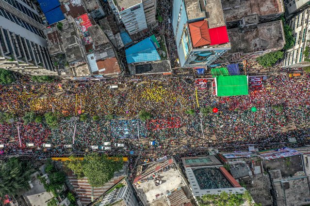 This aerial view shows Bangladesh Nationalist Party (BNP) activists demanding justice for those injured during the 2024 mass uprising in Bangladesh, marching through the streets of Dhaka on May 28, 2025. Protests have become part of daily life in Bangladesh's capital, with residents either taking part as political parties jostle for power after an uprising last year – or avoiding them. On May 28, at least half a dozen demonstrations were held in the sprawling megacity of Dhaka, home to more than 20 million people. (Photo by Abdul Goni/AFP Photo)